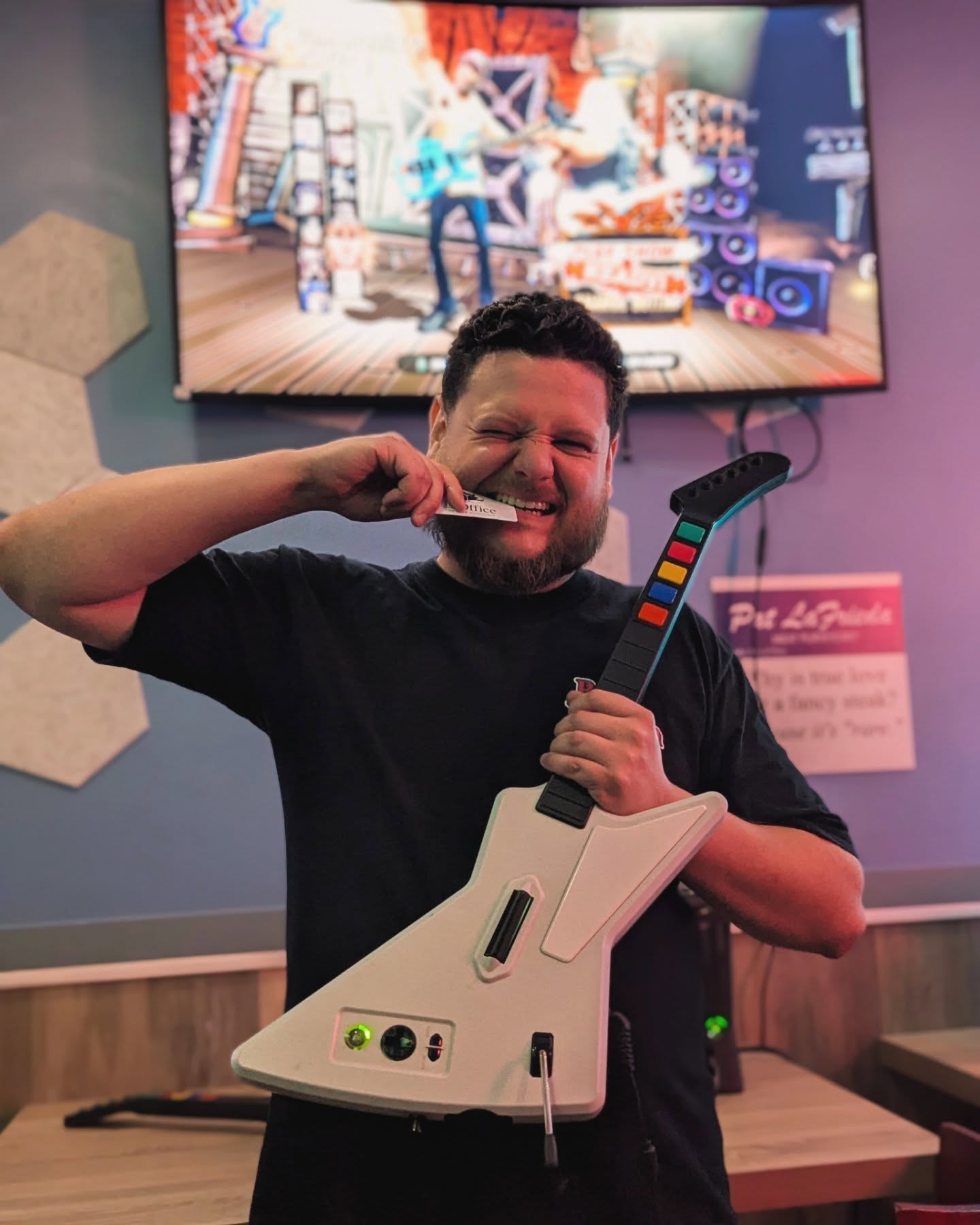 Rock Band tournament winner with guitar